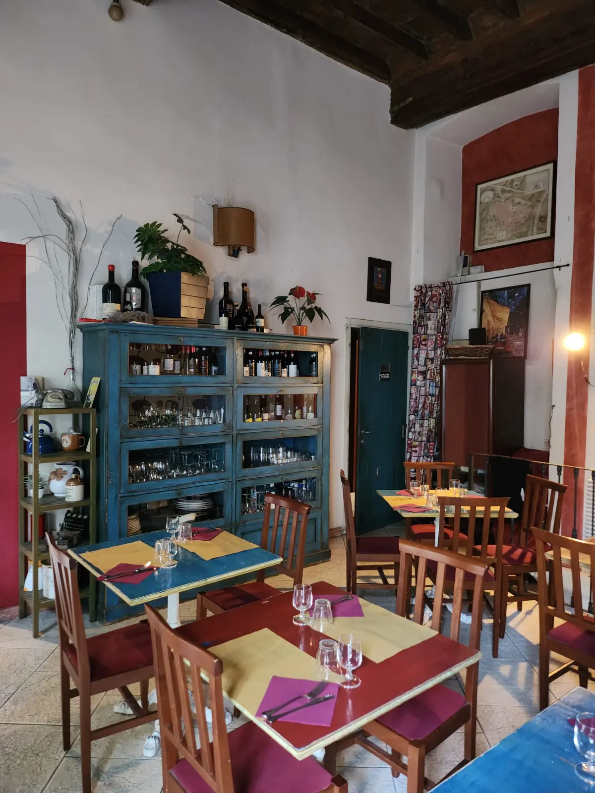 The blue sideboard with wine bottles
