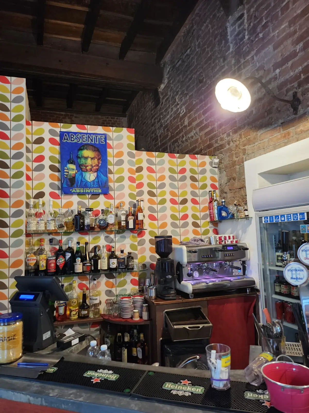 The counter, with colorful leaf-patterned wallpaper
